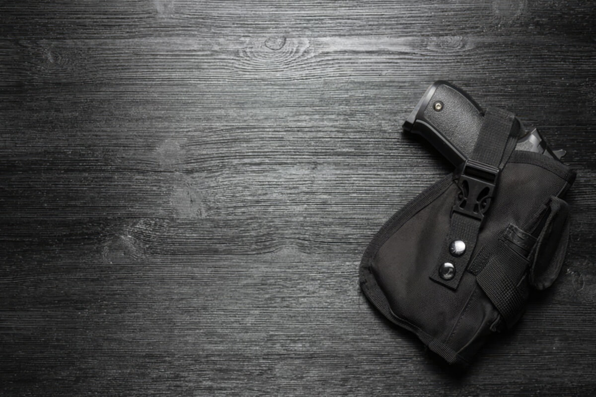 An image of a handgun in a holster