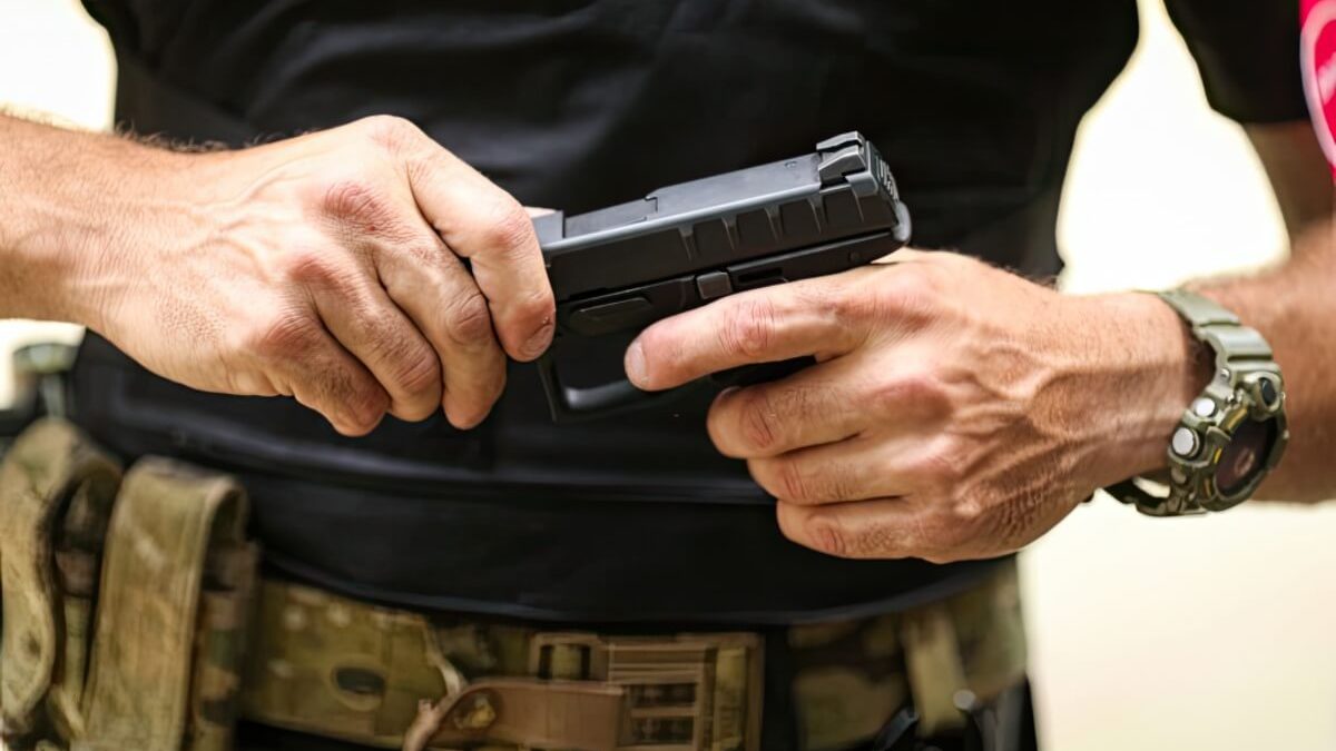 A man handling a firearm safely